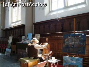 [P01] Westekerk la marginea cartierului Jordaan -biserica de Vest unde doarme Rembrandt -un pictor deseneaza un crampei din Amsterdamul contemporan.  » foto by mireille
 - 
<span class="allrVoted glyphicon glyphicon-heart hidden" id="av944661"></span>
<a class="m-l-10 hidden" id="sv944661" onclick="voting_Foto_DelVot(,944661,1639)" role="button">șterge vot <span class="glyphicon glyphicon-remove"></span></a>
<a id="v9944661" class=" c-red"  onclick="voting_Foto_SetVot(944661)" role="button"><span class="glyphicon glyphicon-heart-empty"></span> <b>LIKE</b> = Votează poza</a> <img class="hidden"  id="f944661W9" src="/imagini/loader.gif" border="0" /><span class="AjErrMes hidden" id="e944661ErM"></span>