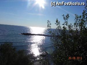 [P07] Mese pot fi servite pe terasa restaurantului... peisajul foarte frumos. Pacat ca mesele sunt pline de praf sau nisip, iar din 5-6 ospatari care ne-au servit 2-3 au fost foarte ok. Ceilalti aveai impresia ca sunt la munca silnica.  » foto by ionyc
 - 
<span class="allrVoted glyphicon glyphicon-heart hidden" id="av359042"></span>
<a class="m-l-10 hidden" id="sv359042" onclick="voting_Foto_DelVot(,359042,2316)" role="button">șterge vot <span class="glyphicon glyphicon-remove"></span></a>
<a id="v9359042" class=" c-red"  onclick="voting_Foto_SetVot(359042)" role="button"><span class="glyphicon glyphicon-heart-empty"></span> <b>LIKE</b> = Votează poza</a> <img class="hidden"  id="f359042W9" src="/imagini/loader.gif" border="0" /><span class="AjErrMes hidden" id="e359042ErM"></span>