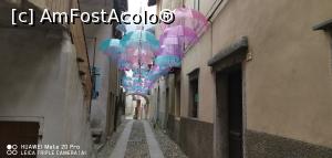 [P06] Strada cu umbrele din satul Mergozzo.  » foto by Aurici
 - 
<span class="allrVoted glyphicon glyphicon-heart hidden" id="av1131142"></span>
<a class="m-l-10 hidden" id="sv1131142" onclick="voting_Foto_DelVot(,1131142,27261)" role="button">șterge vot <span class="glyphicon glyphicon-remove"></span></a>
<a id="v91131142" class=" c-red"  onclick="voting_Foto_SetVot(1131142)" role="button"><span class="glyphicon glyphicon-heart-empty"></span> <b>LIKE</b> = Votează poza</a> <img class="hidden"  id="f1131142W9" src="/imagini/loader.gif" border="0" /><span class="AjErrMes hidden" id="e1131142ErM"></span>